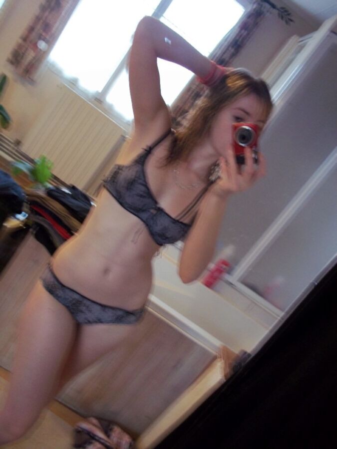 Sexy blonde teen taking nude selfies