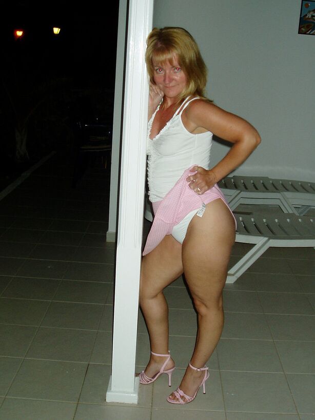 Mrs G - outdoors - balcony night