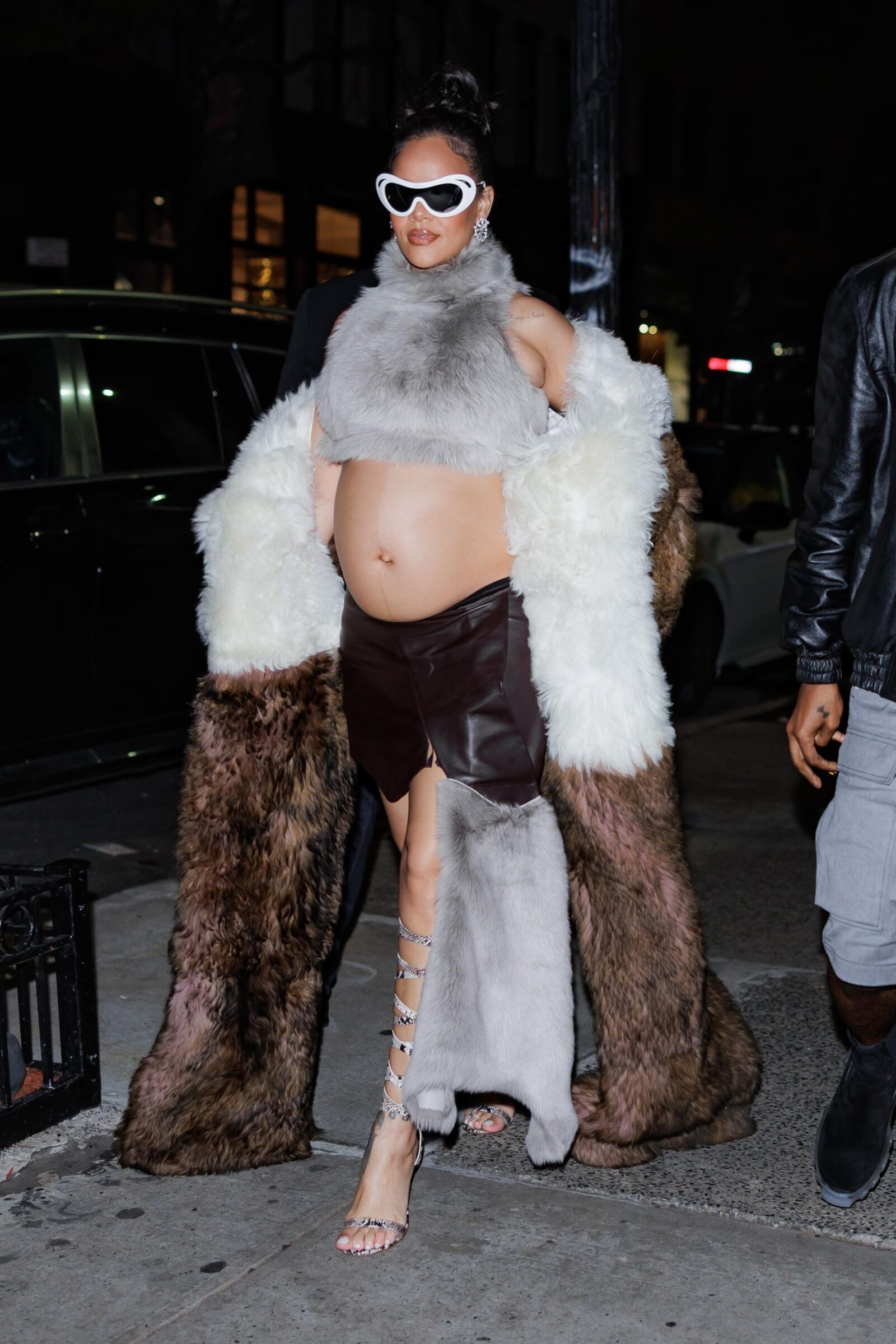 Rihanna - Shows off her bump in a fur coat 