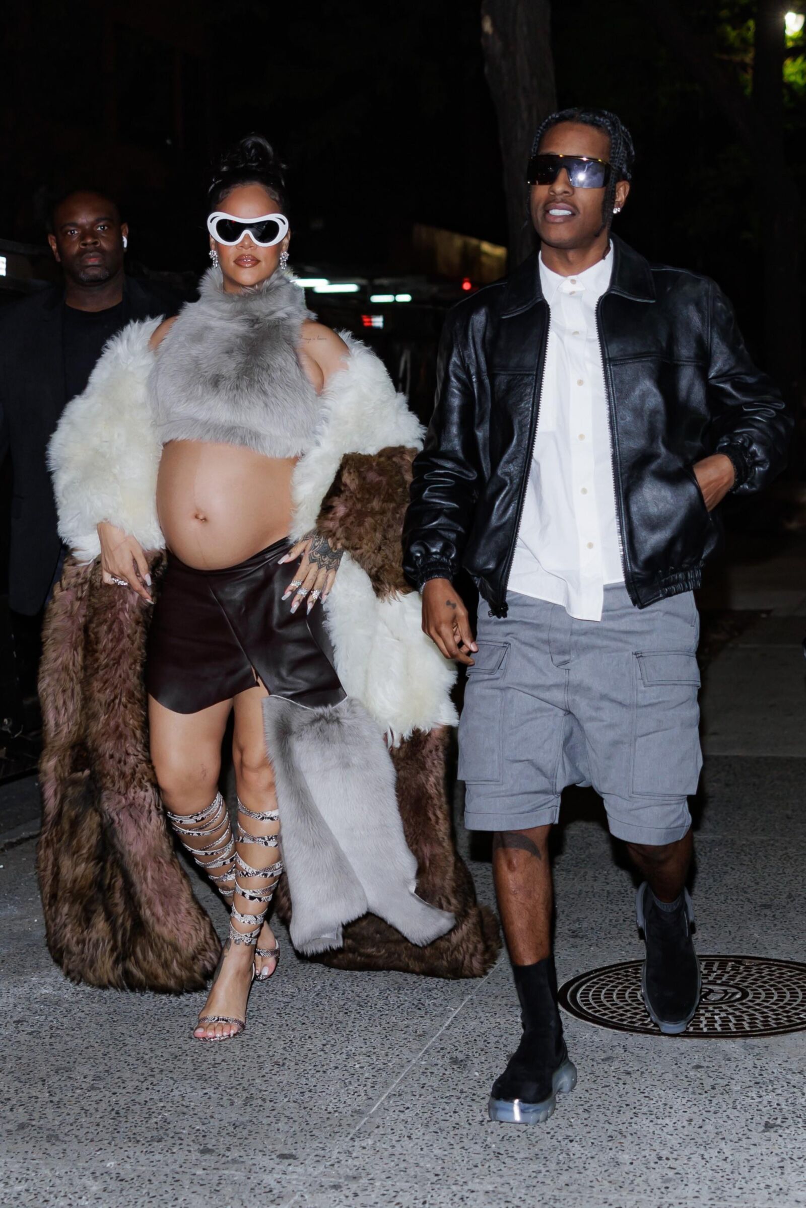 Rihanna - Shows off her bump in a fur coat 