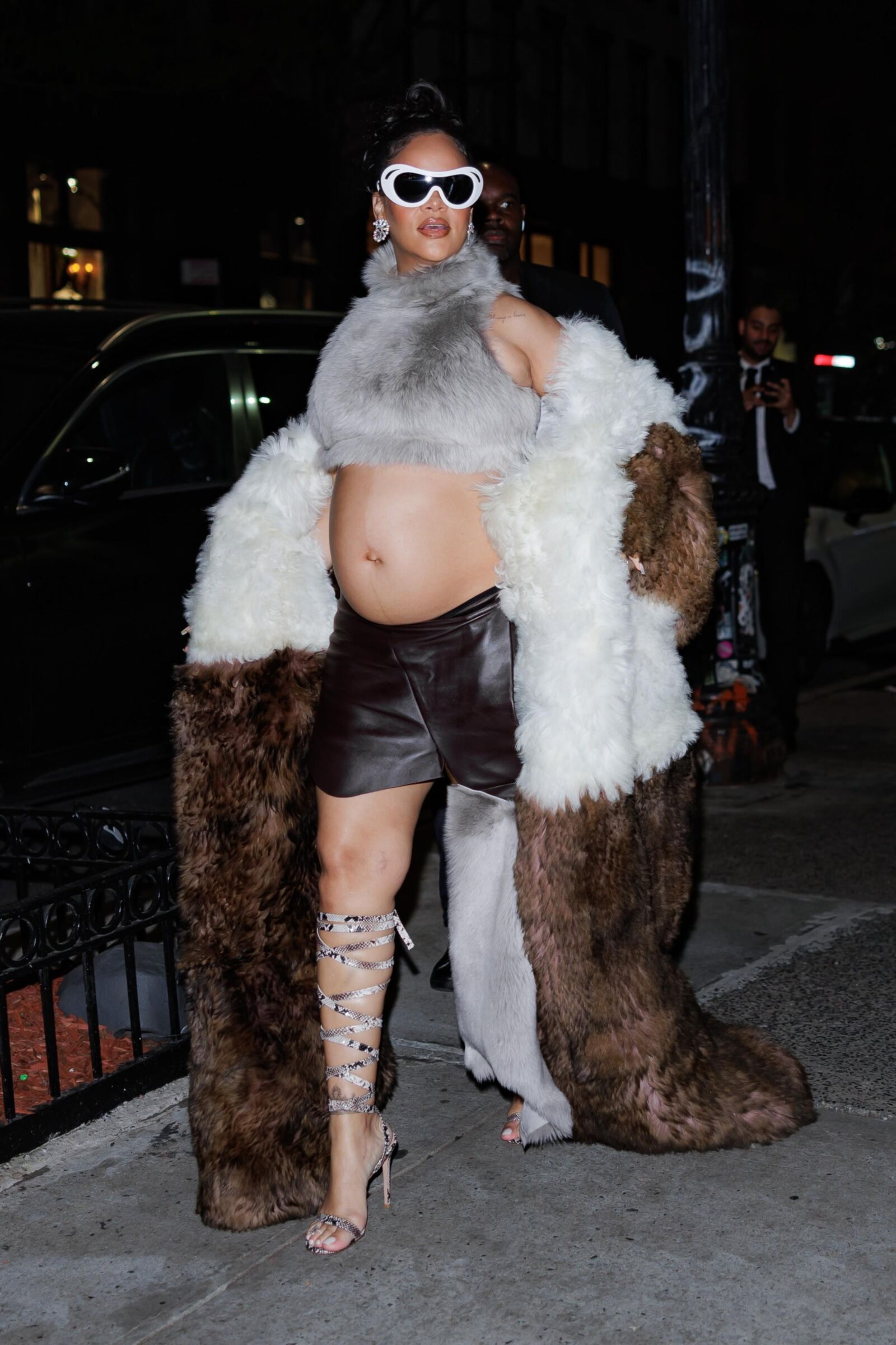 Rihanna - Shows off her bump in a fur coat 