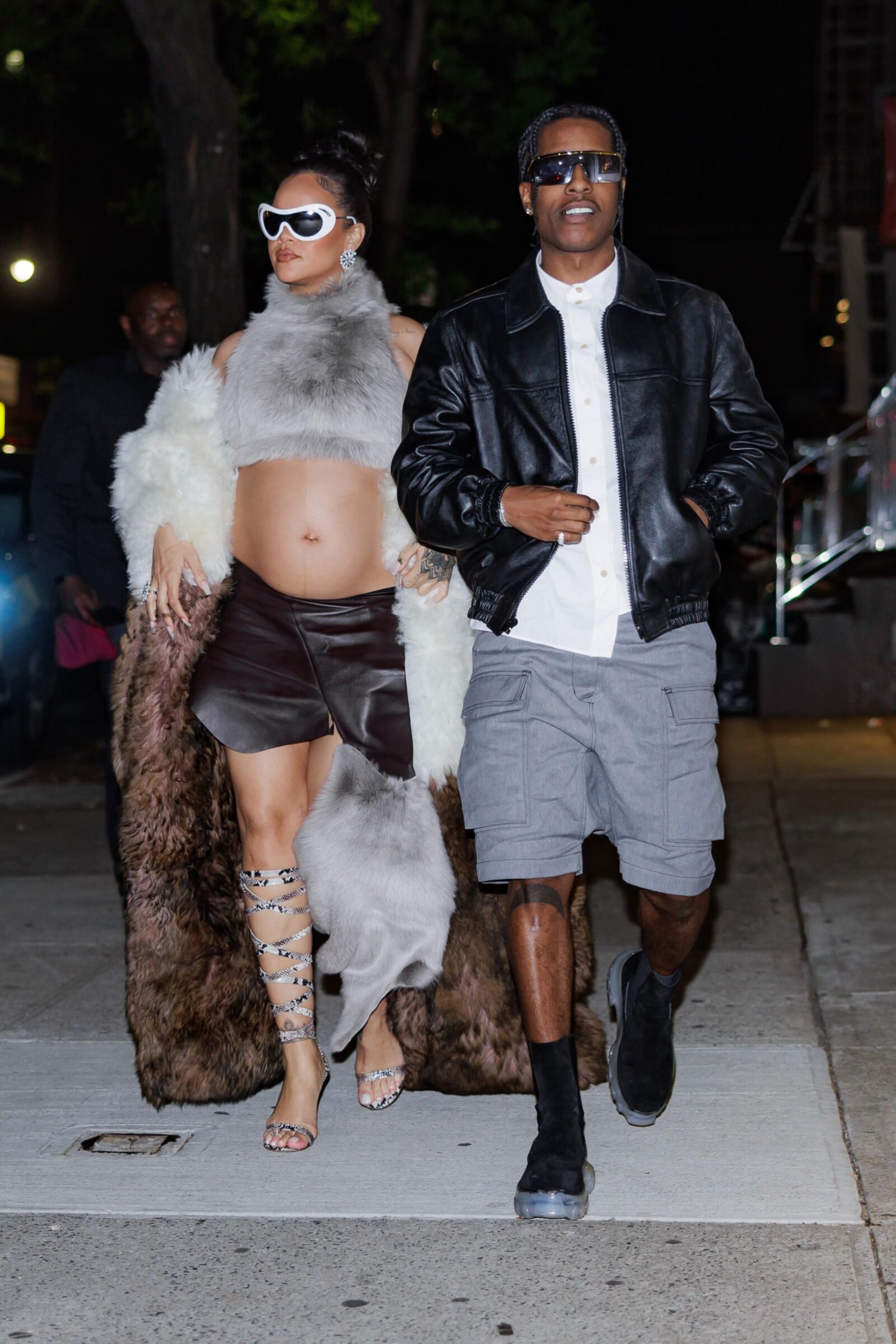 Rihanna - Shows off her bump in a fur coat 