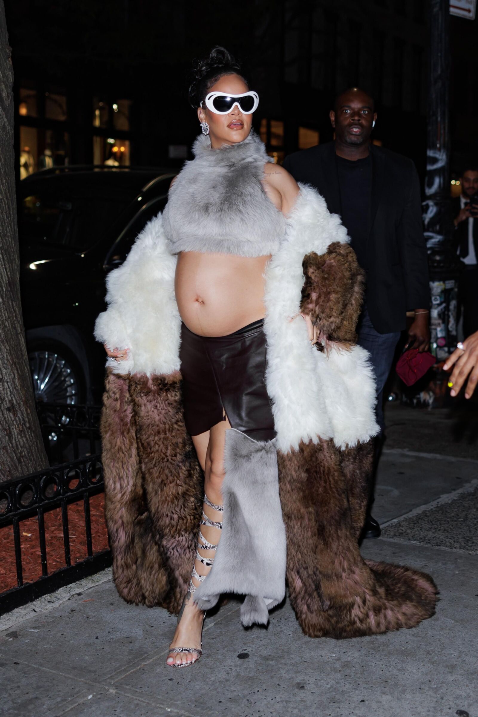 Rihanna - Shows off her bump in a fur coat 