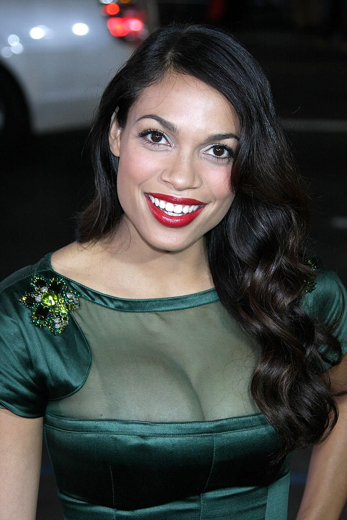 Rosario Dawson wraps her latin curves in green