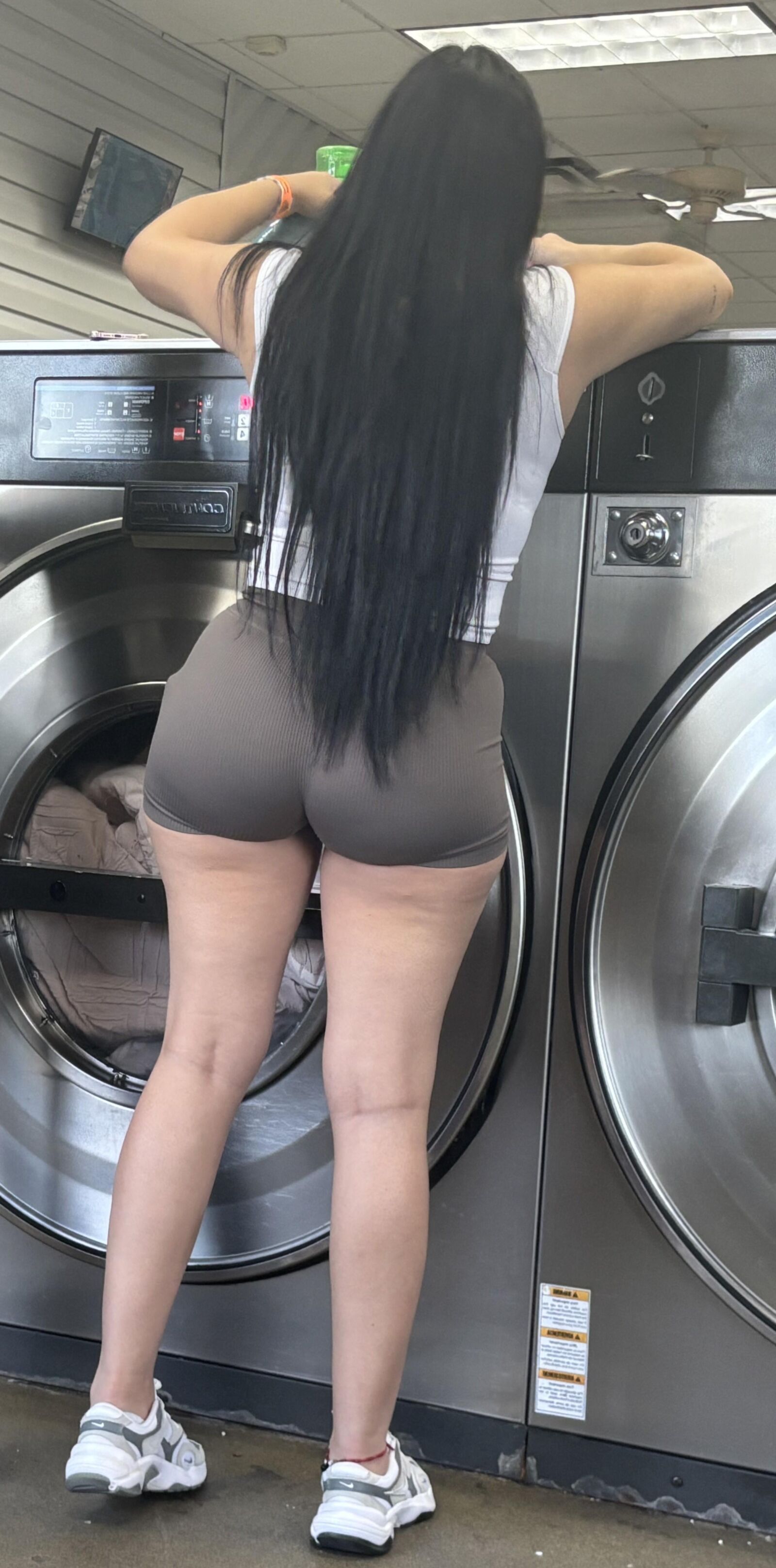 Hot latina bending over at laundromat