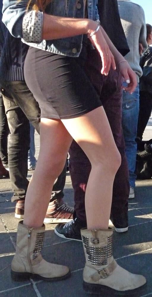 Sexy girl in pantyhose dancing in the street