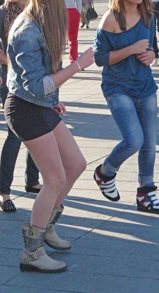 Sexy girl in pantyhose dancing in the street