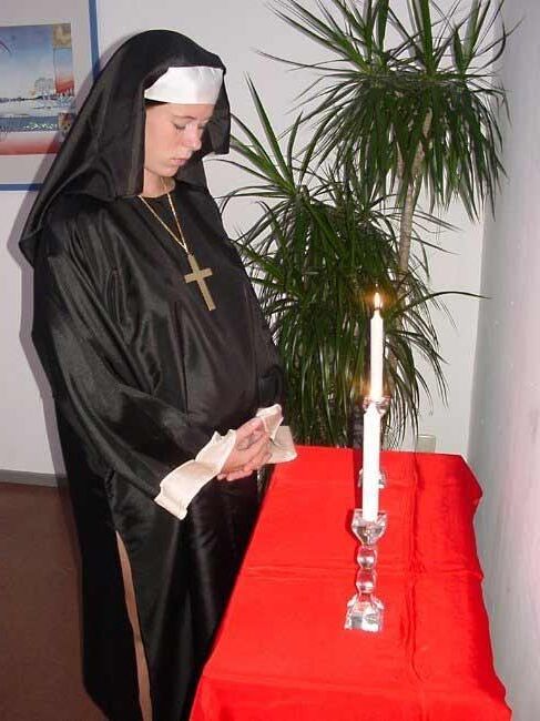 Ilona pregnant dressed as a  nun