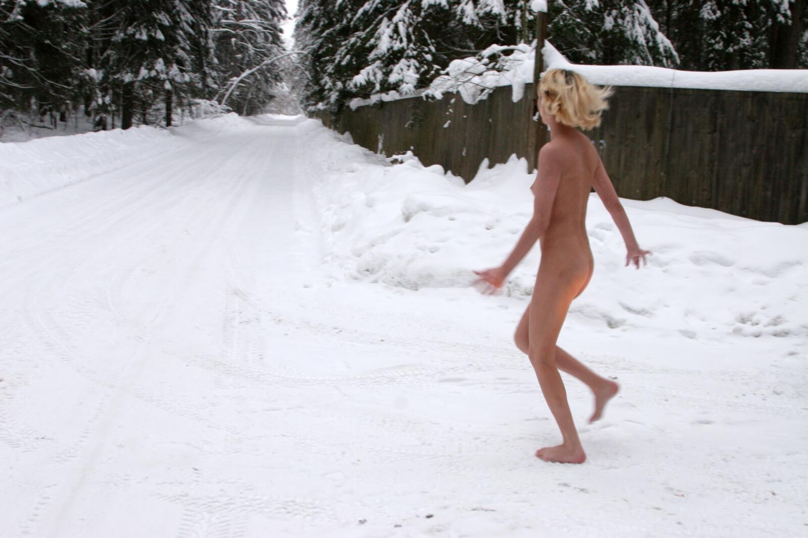 Young Blonde peeing in the snow