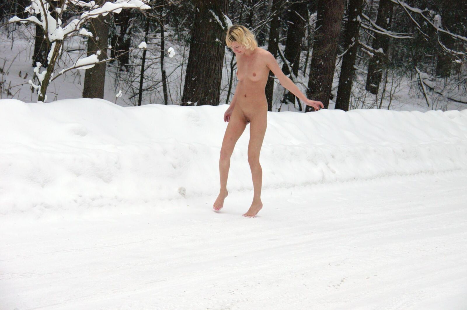 Young Blonde peeing in the snow