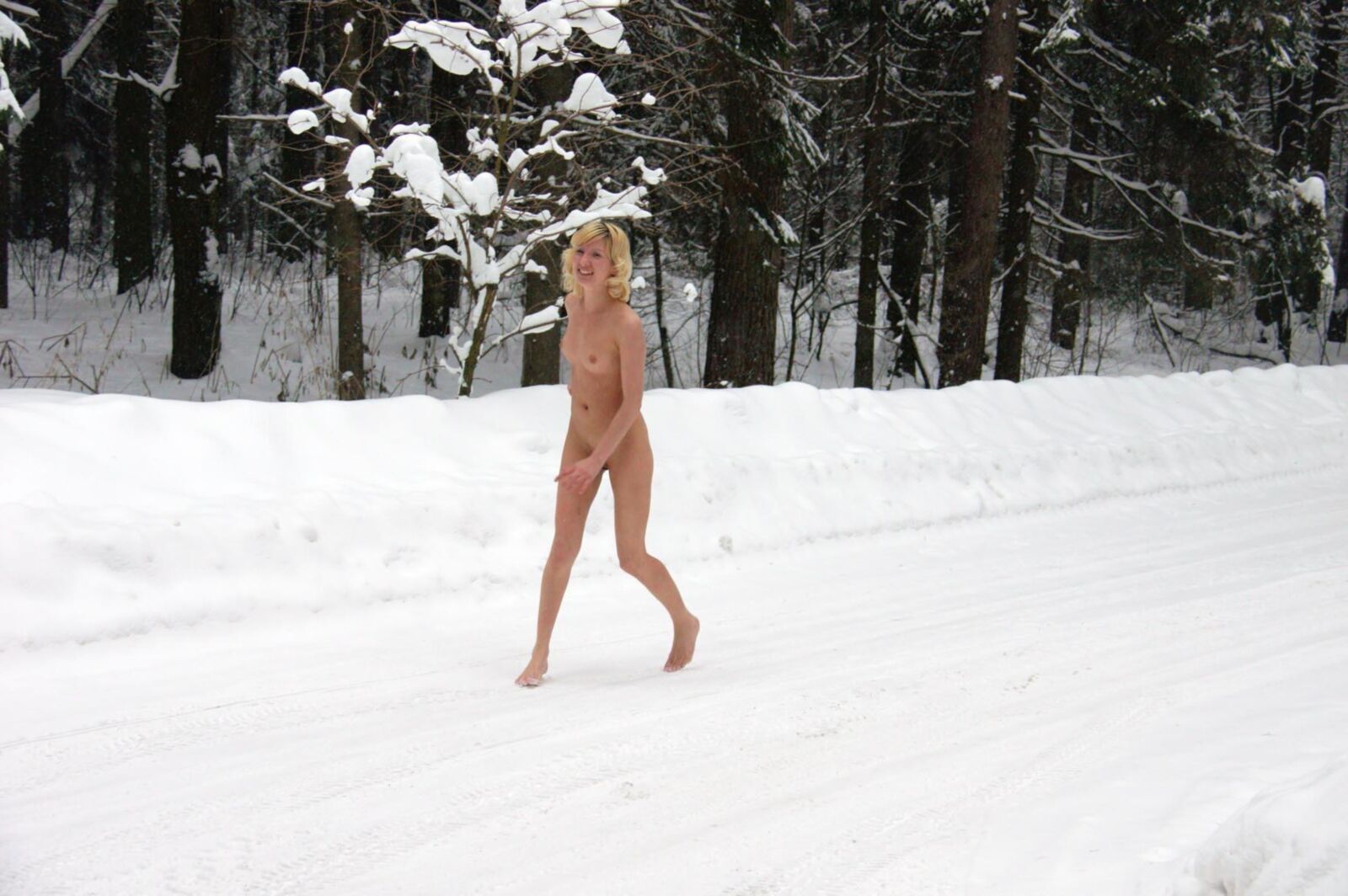 Young Blonde peeing in the snow