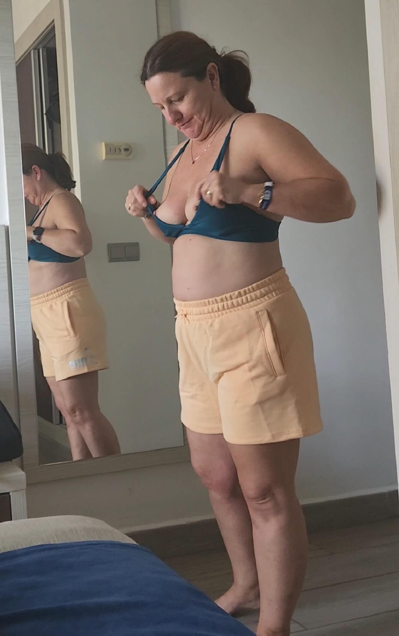 Chubby milf in various bikinis, non nude. 