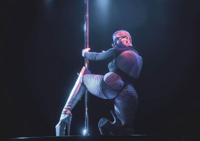 shaved head pole dancer