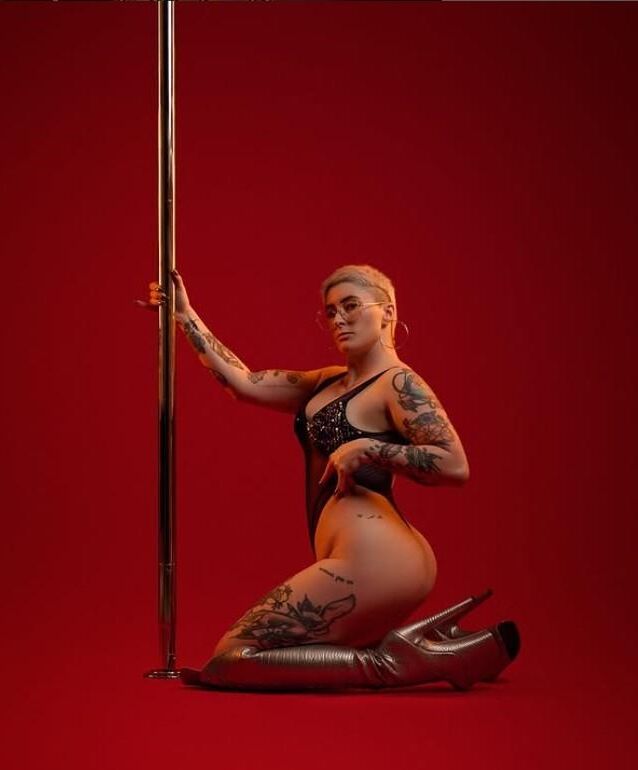 shaved head pole dancer