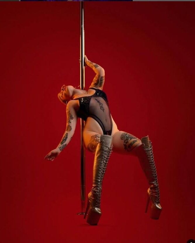 shaved head pole dancer