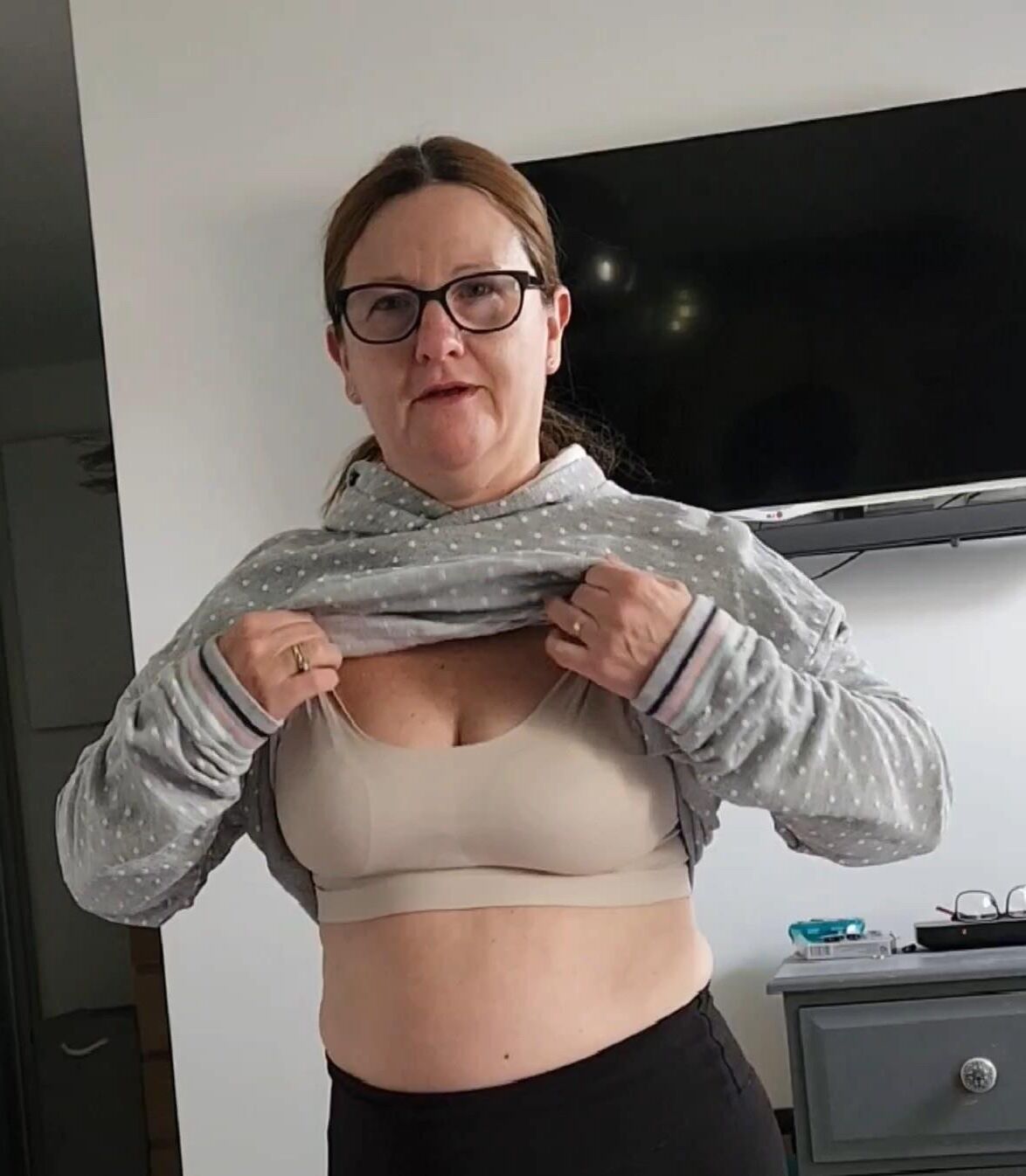 Mature chubby milf in her bra, want her to take any off? 