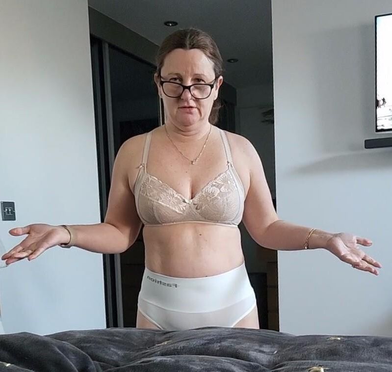 Mature chubby milf in her bra, want her to take any off? 