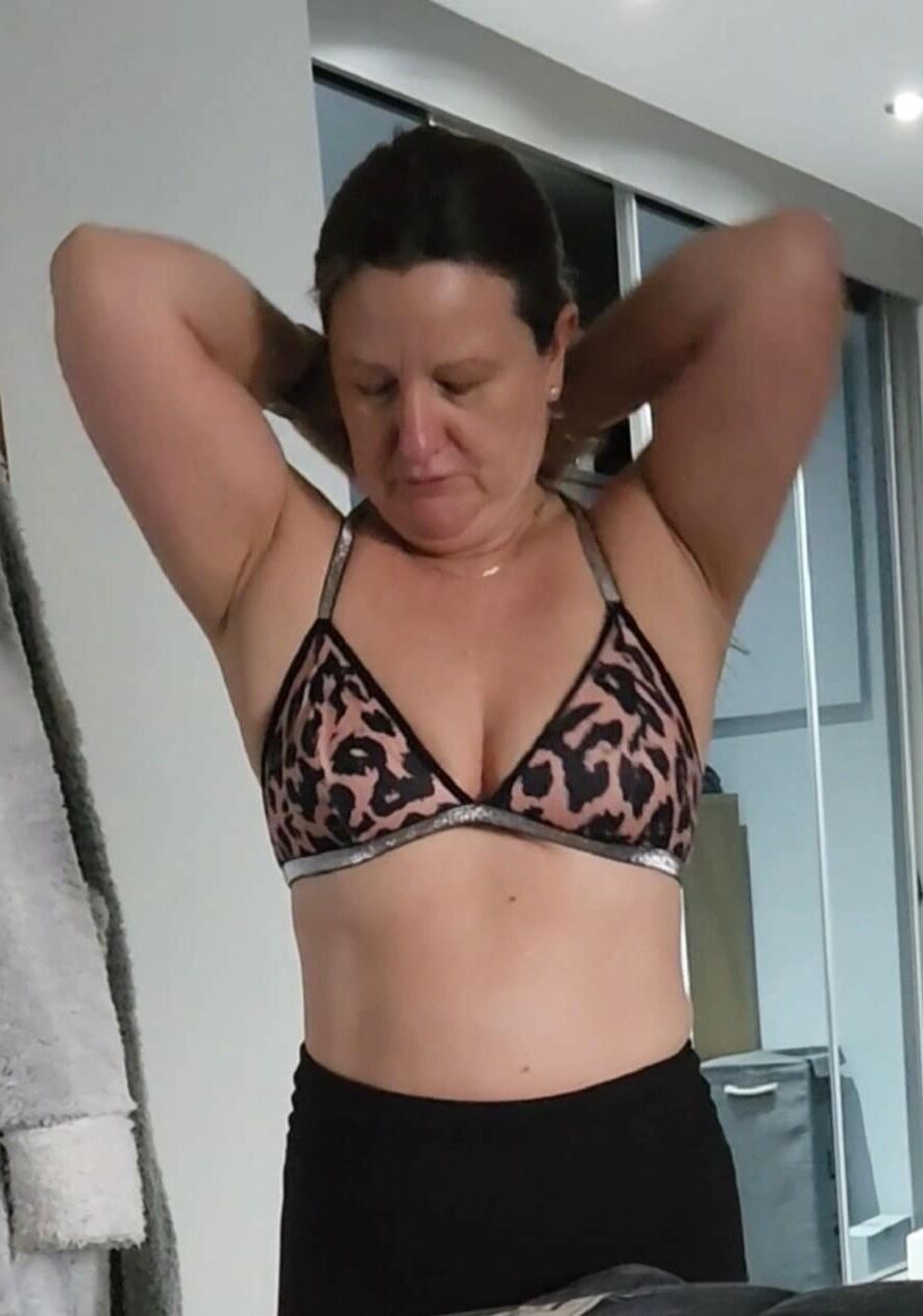 Mature chubby milf in her bra, want her to take any off? 