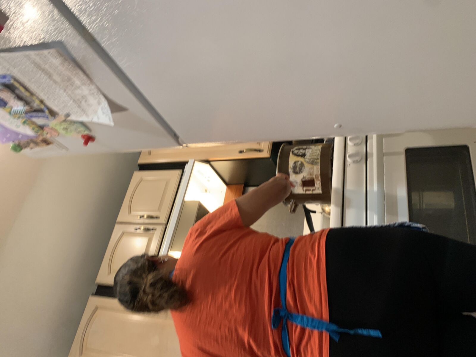 Guatemalan SIL making tamales in black leggings