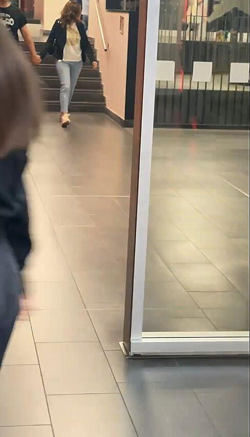 An old whore exposed in a shopping center to order