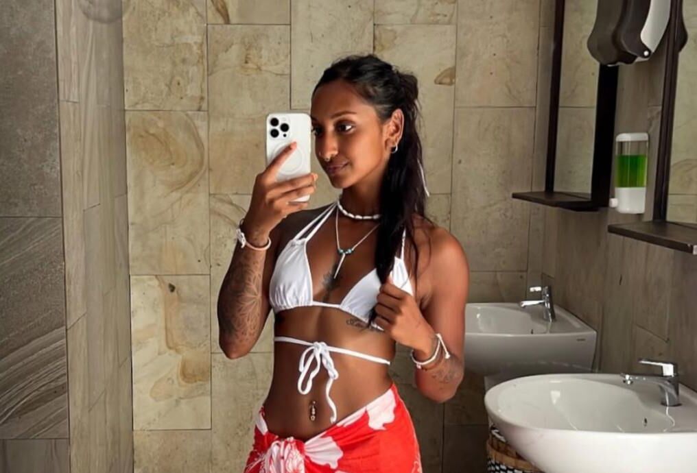 Jitta White bikini portrait.