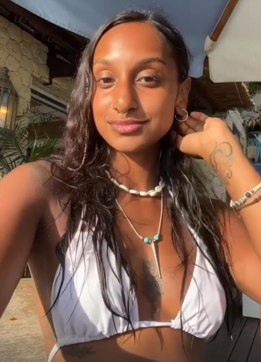 Jitta White bikini portrait.