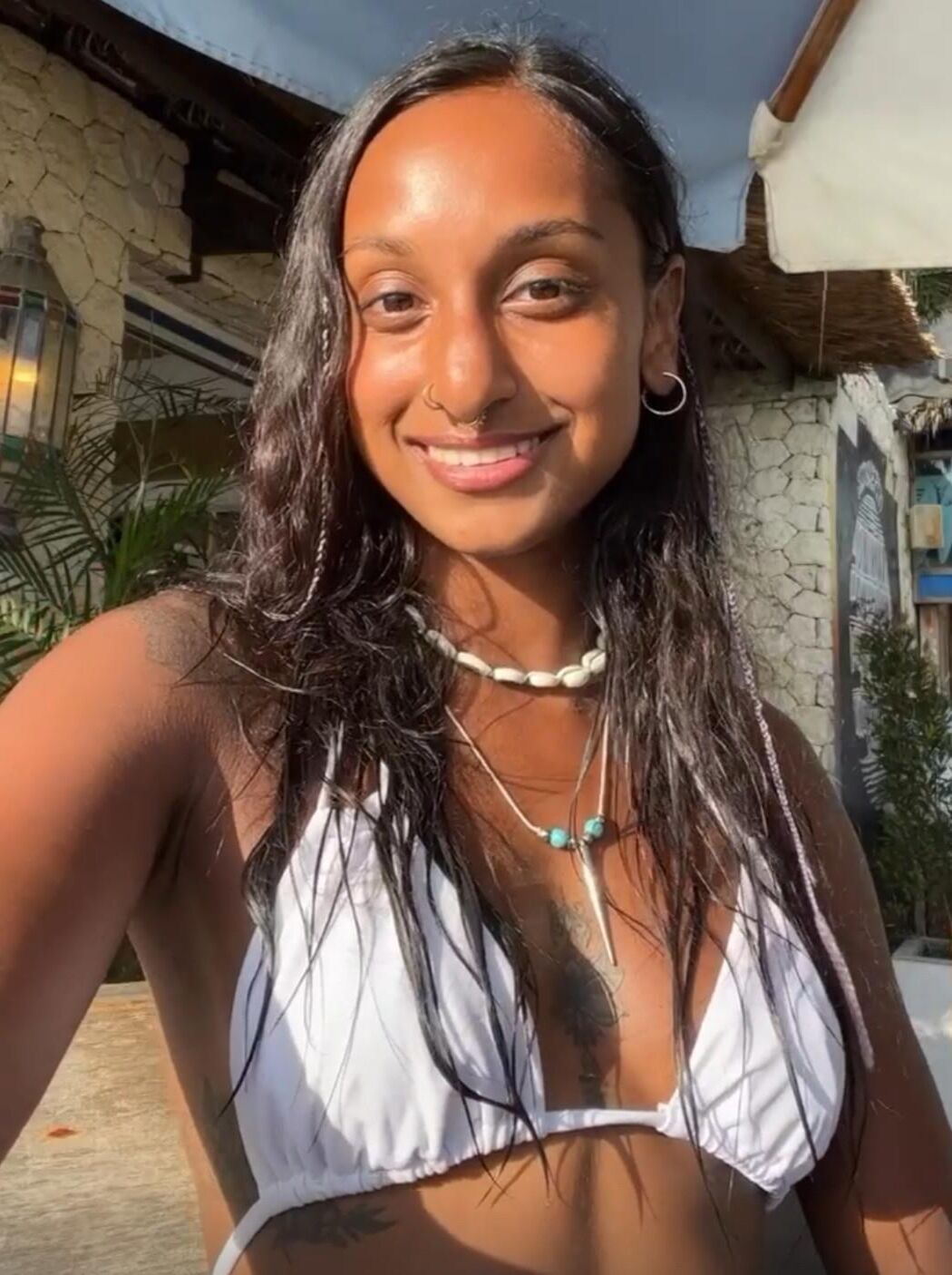 Jitta White bikini portrait.