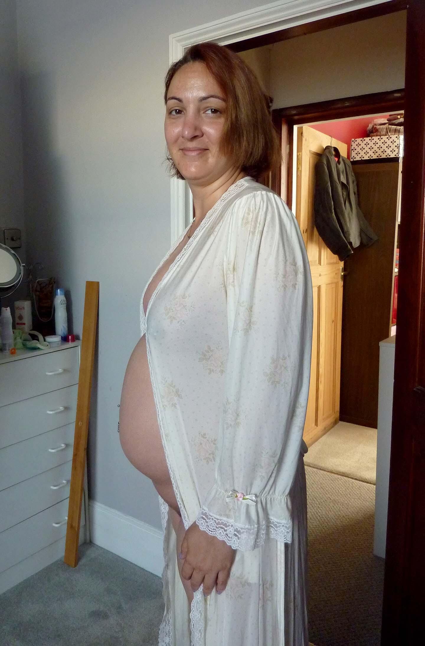 Pregnant wife in see through gown