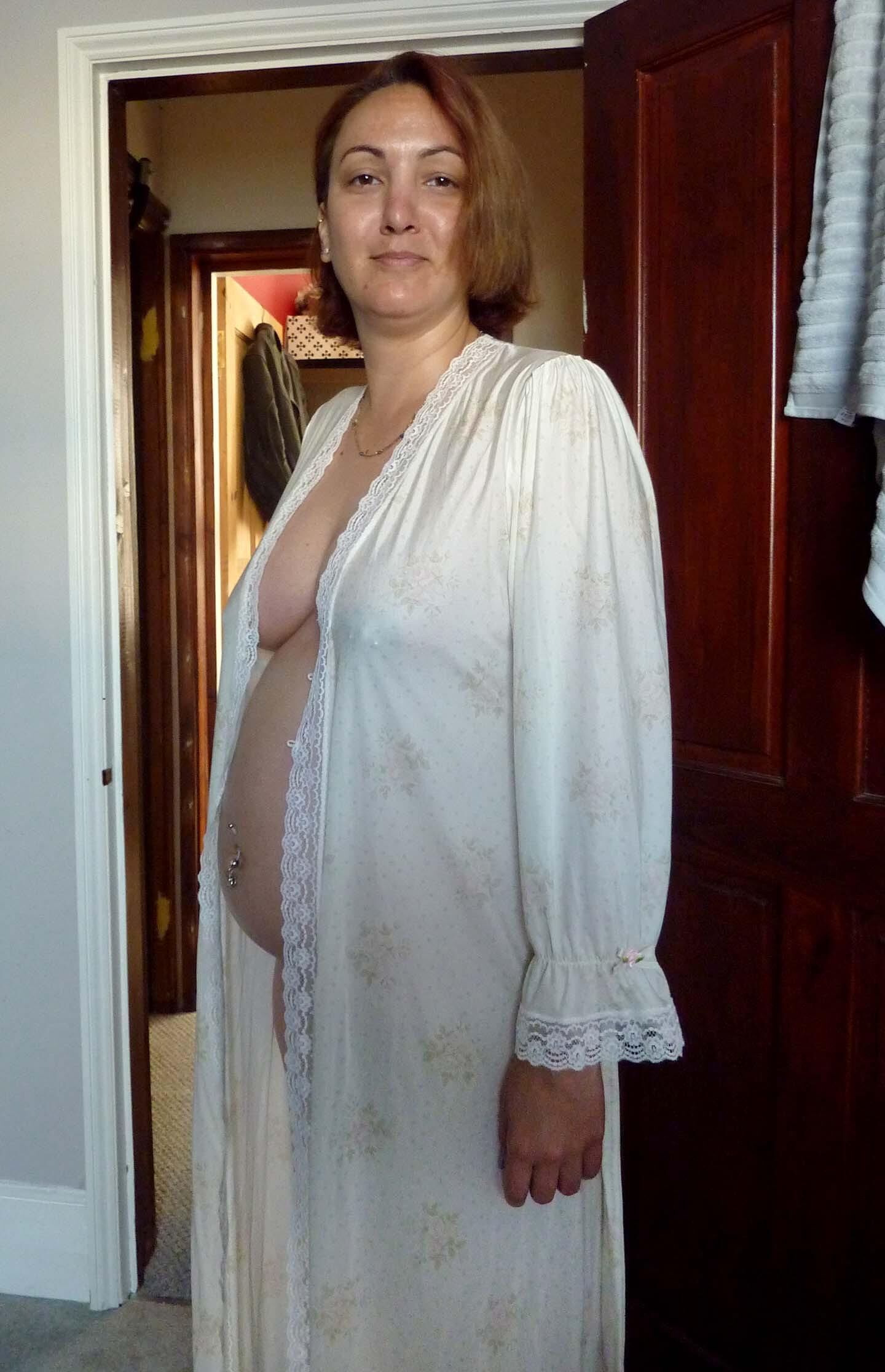 Pregnant wife in see through gown