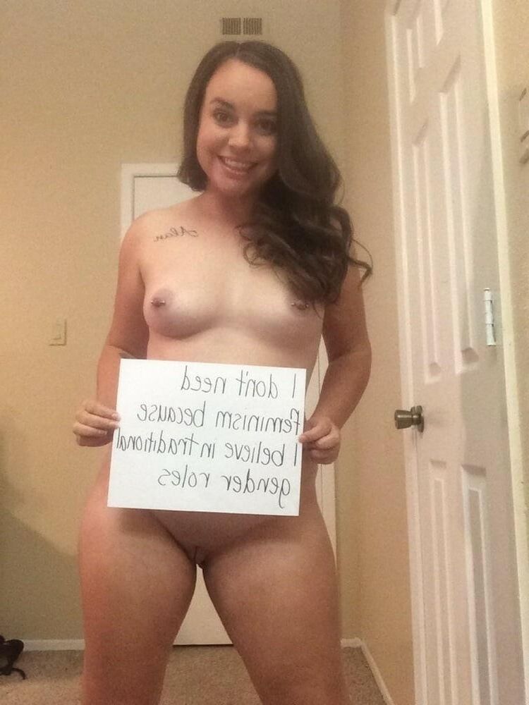 naked women holding signs 