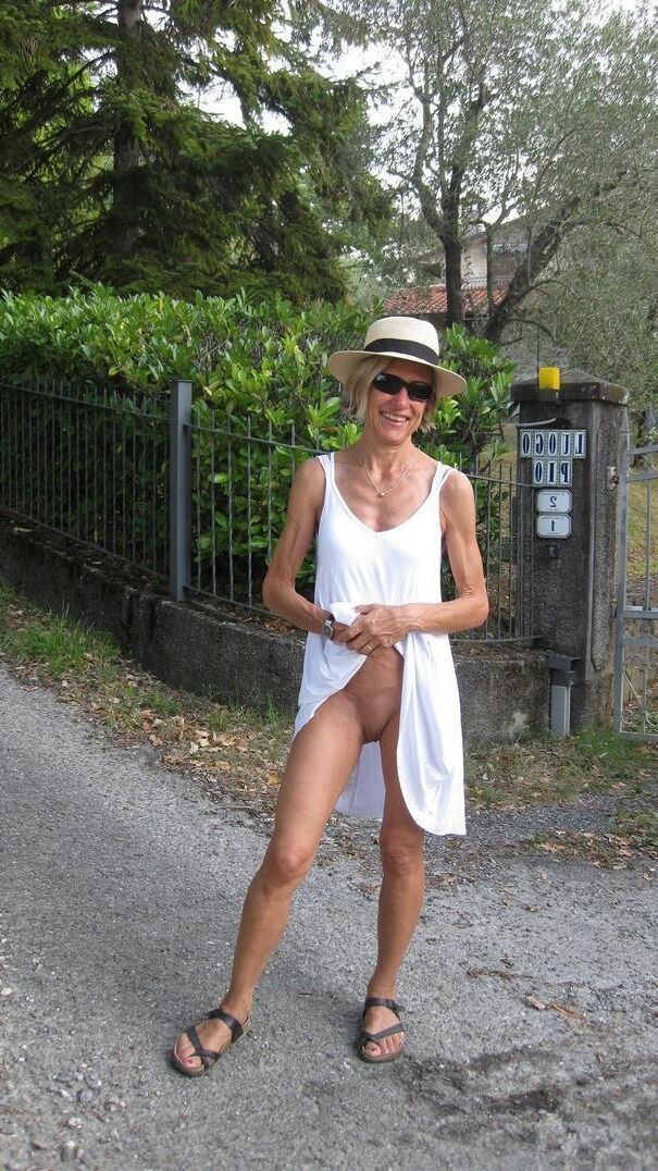 Women Standing Naked Commando Wearing a Watch