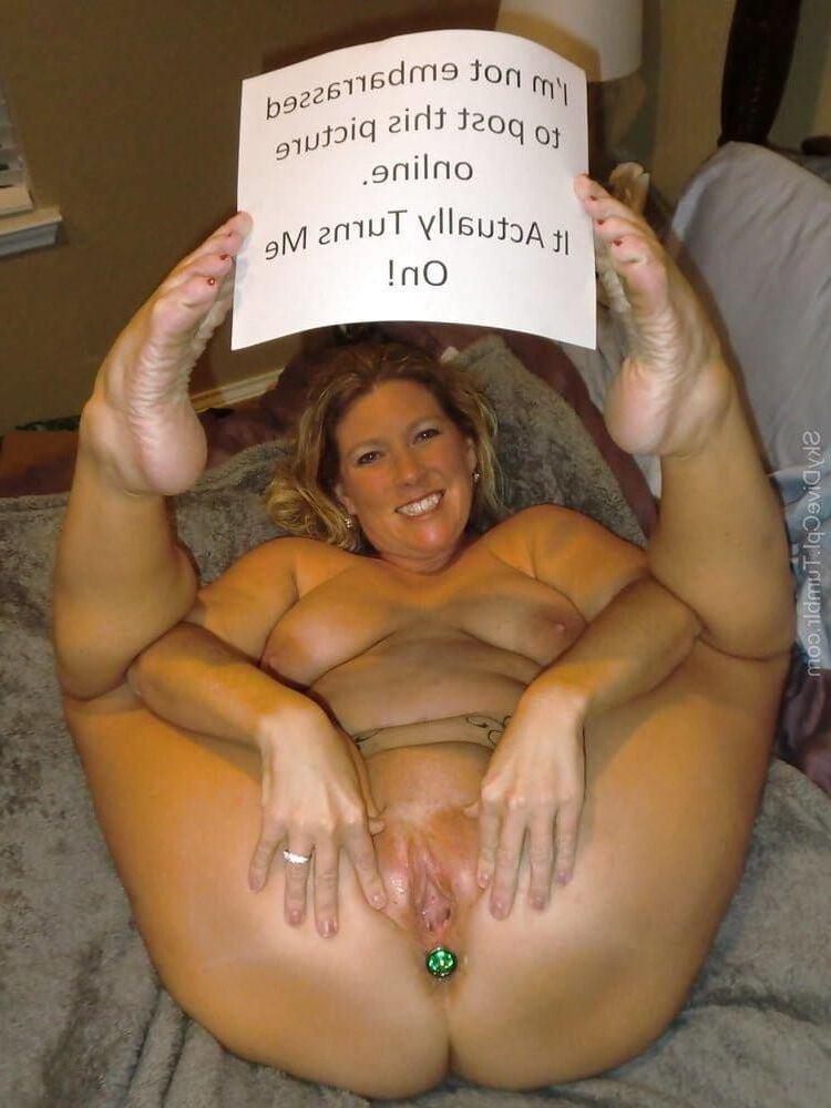 naked women holding signs 