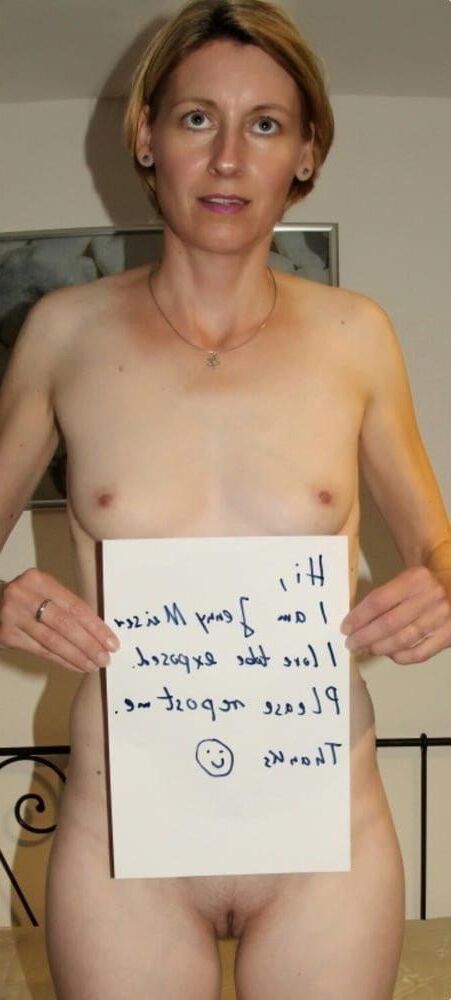 naked women holding signs 