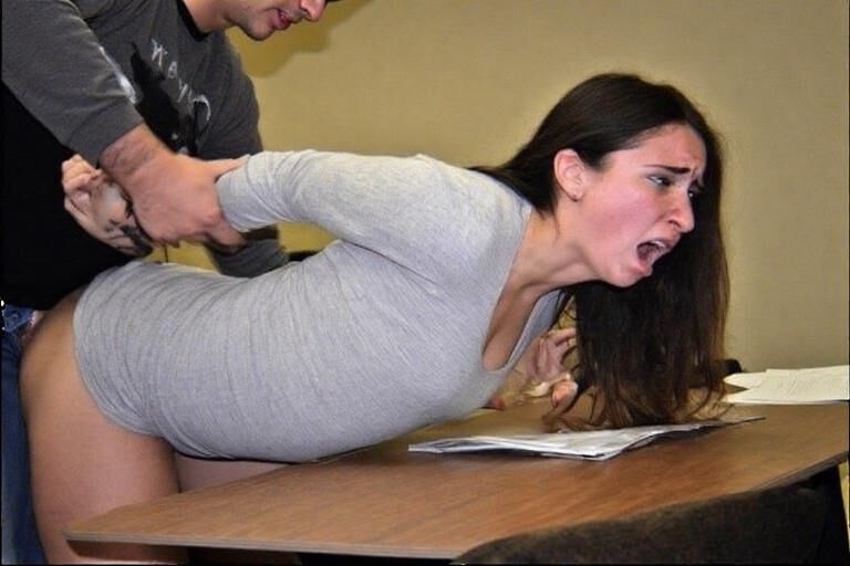 Bent over desks