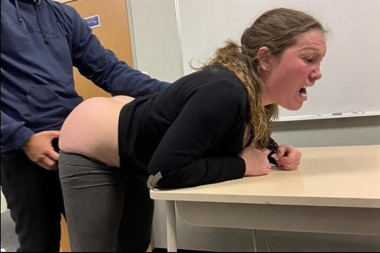 Bent over desks