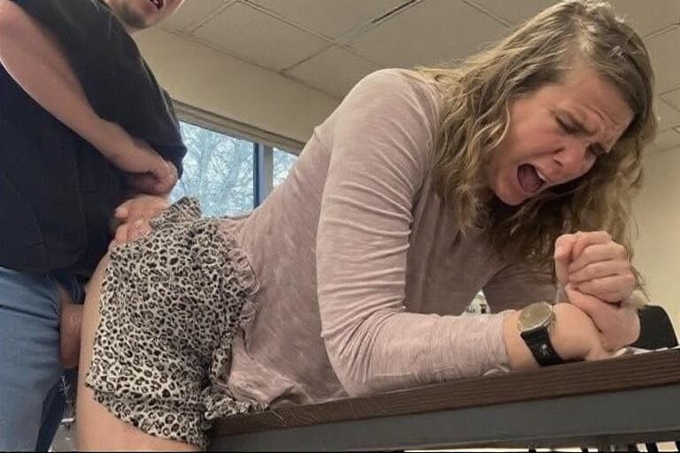 Bent over desks