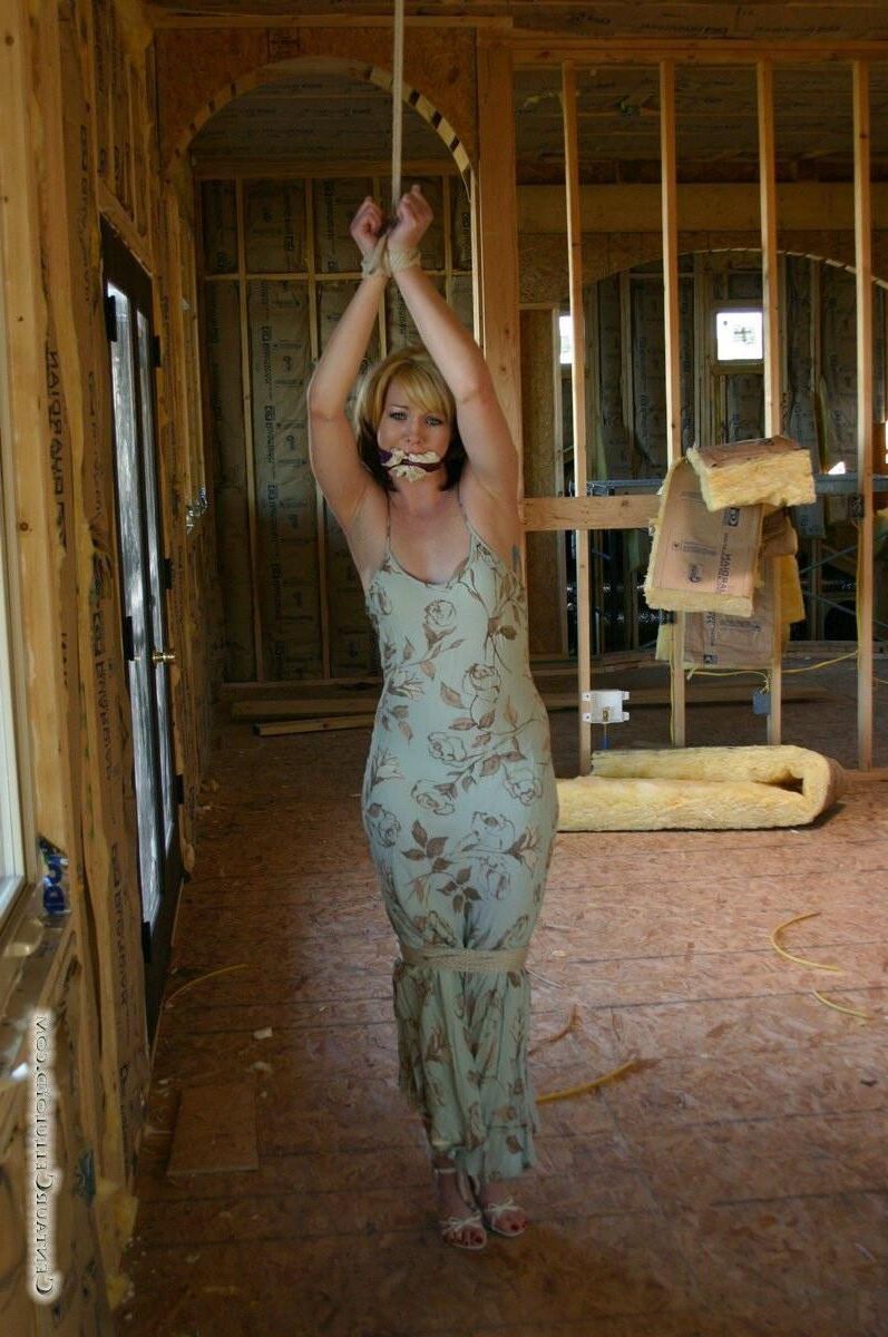 Bound in her summer dress and sandals