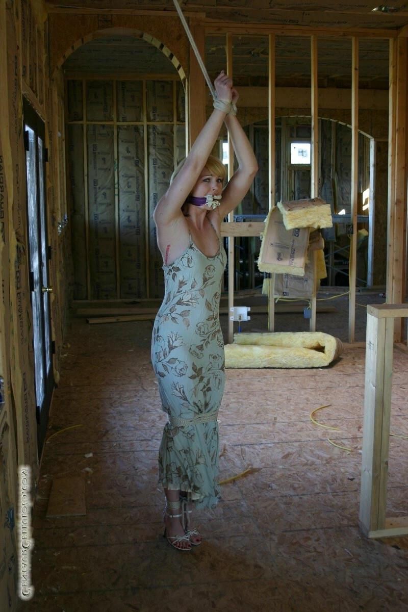 Bound in her summer dress and sandals