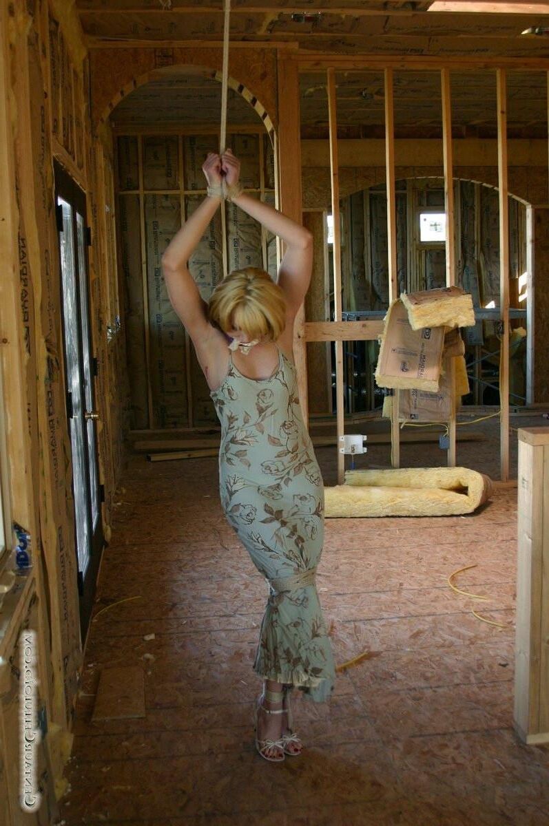 Bound in her summer dress and sandals