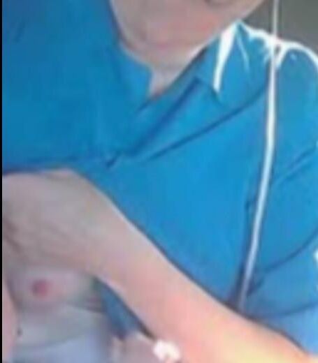 Amish Woman Breastfeeding Blue Dress