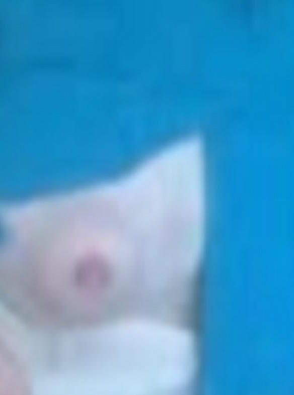 Amish Woman Breastfeeding Blue Dress