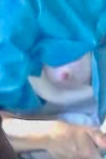 Amish Woman Breastfeeding Blue Dress