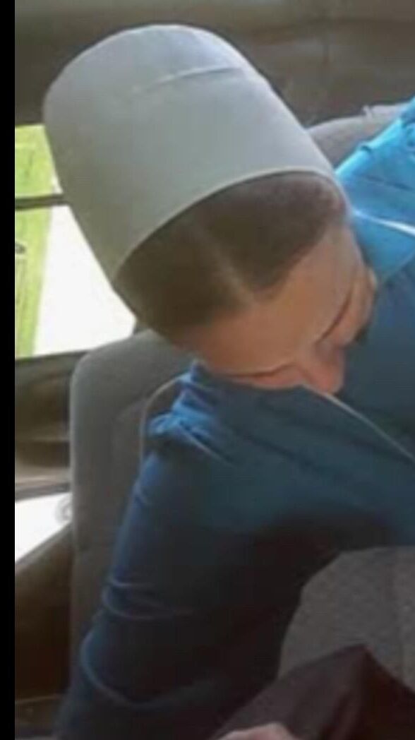 Amish Woman Breastfeeding Blue Dress