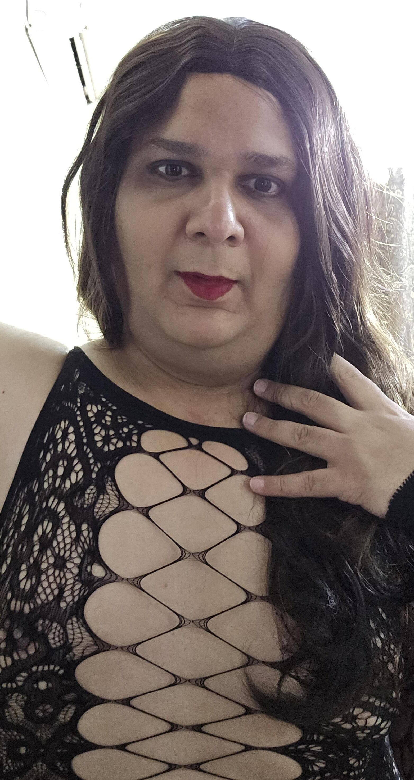 brunette shemale monica m shows off in mini fishnets stockings 