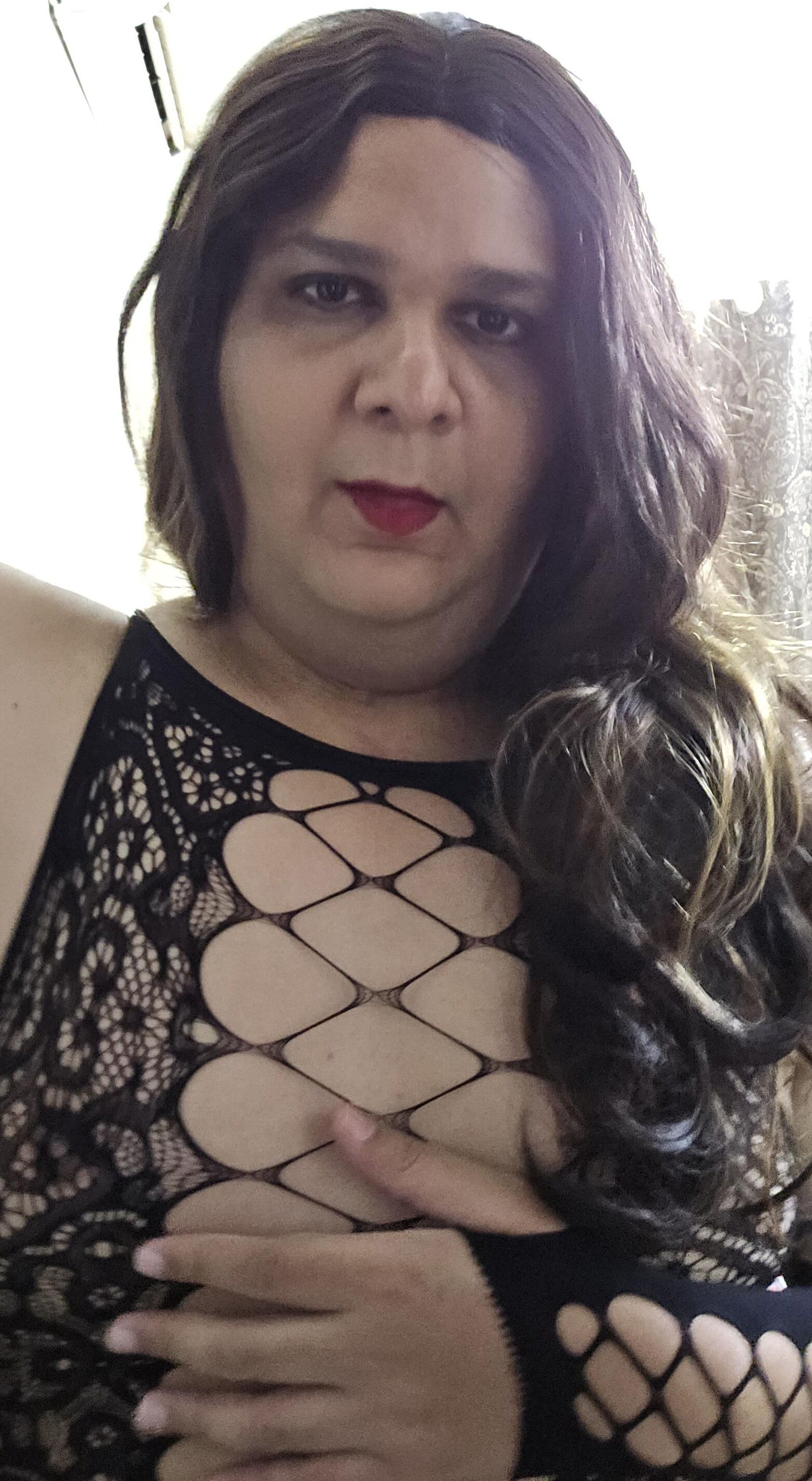 brunette shemale monica m shows off in mini fishnets stockings 