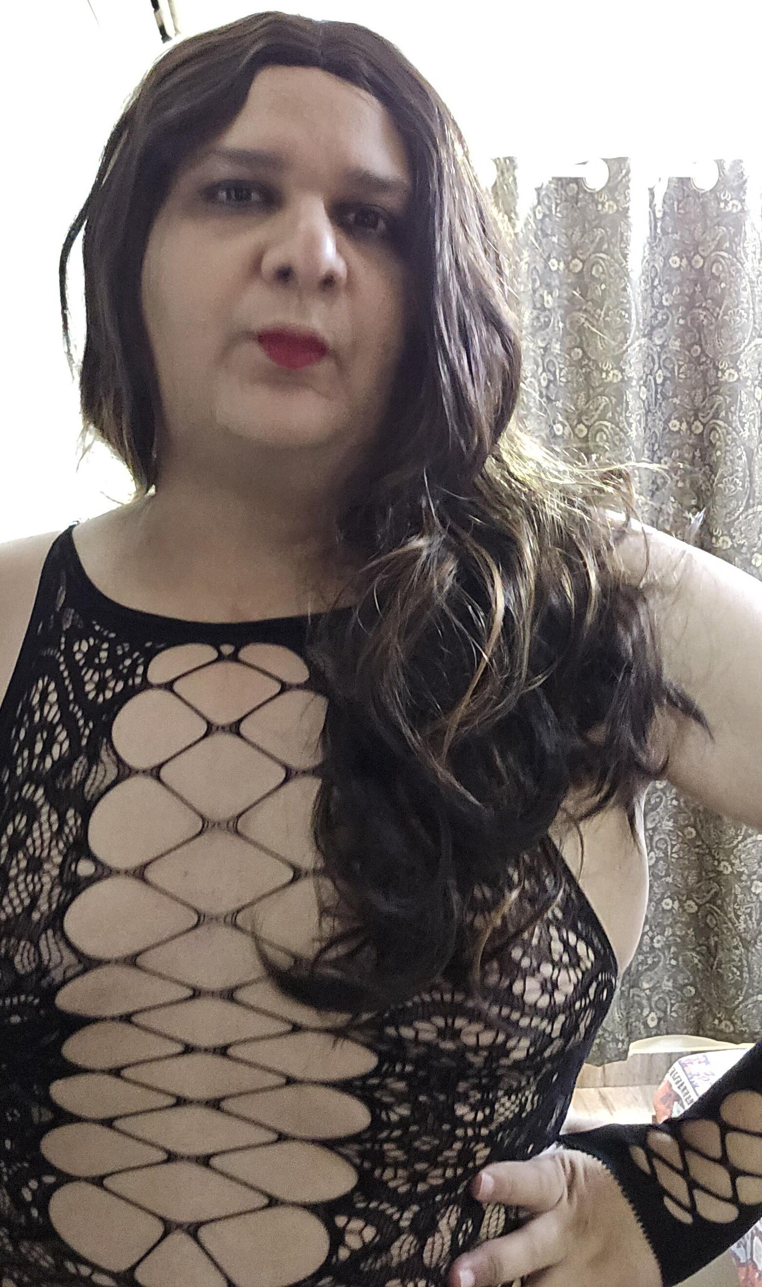 brunette shemale monica m shows off in mini fishnets stockings 