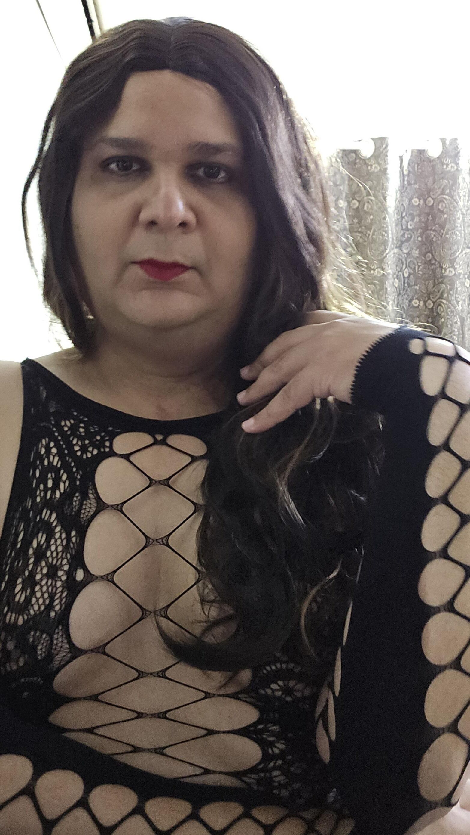 brunette shemale monica m shows off in mini fishnets stockings 