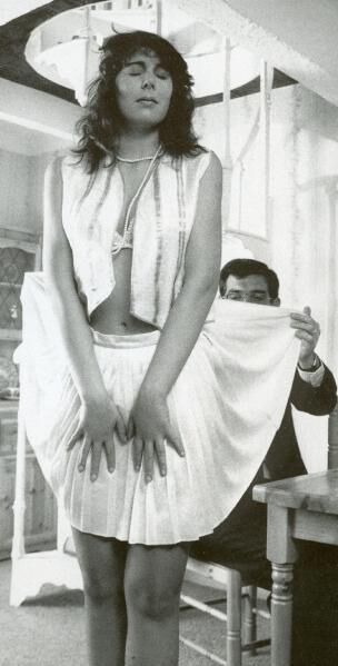 Retro Spanking from Janus white mini skirt on chair