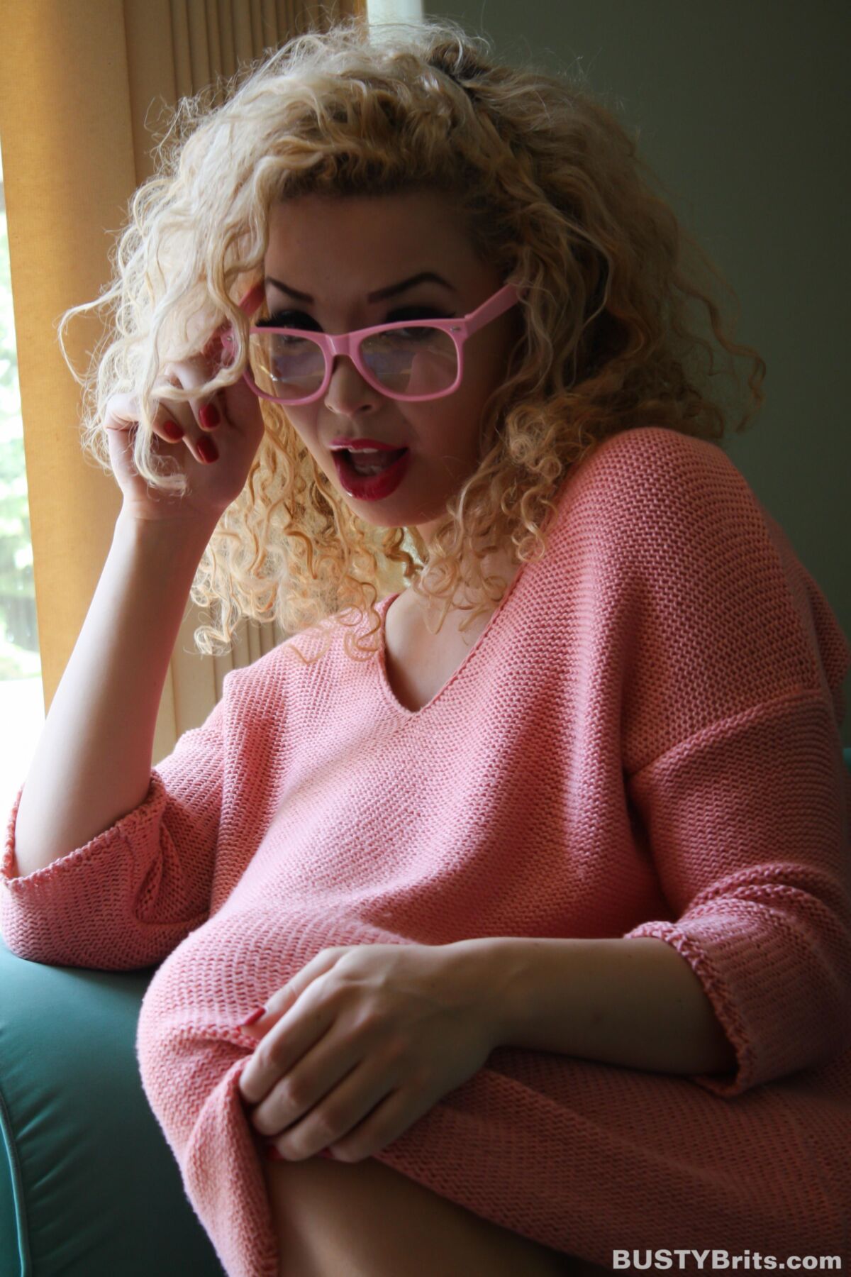Aruba Jasmine Cute Busty British Blonde Latina in a Pink Sweater