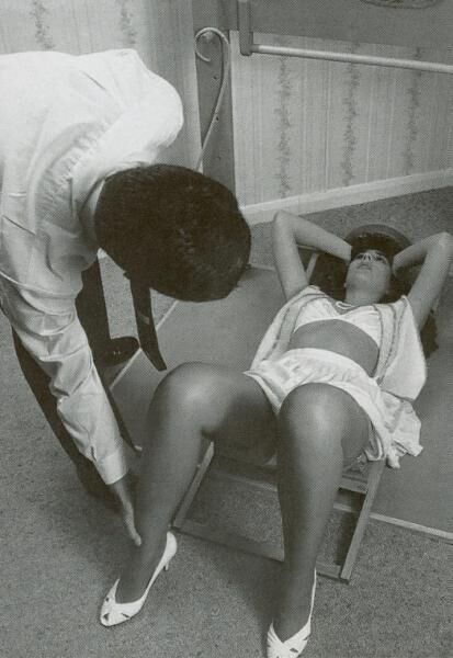 Retro Spanking from Janus white mini skirt on chair